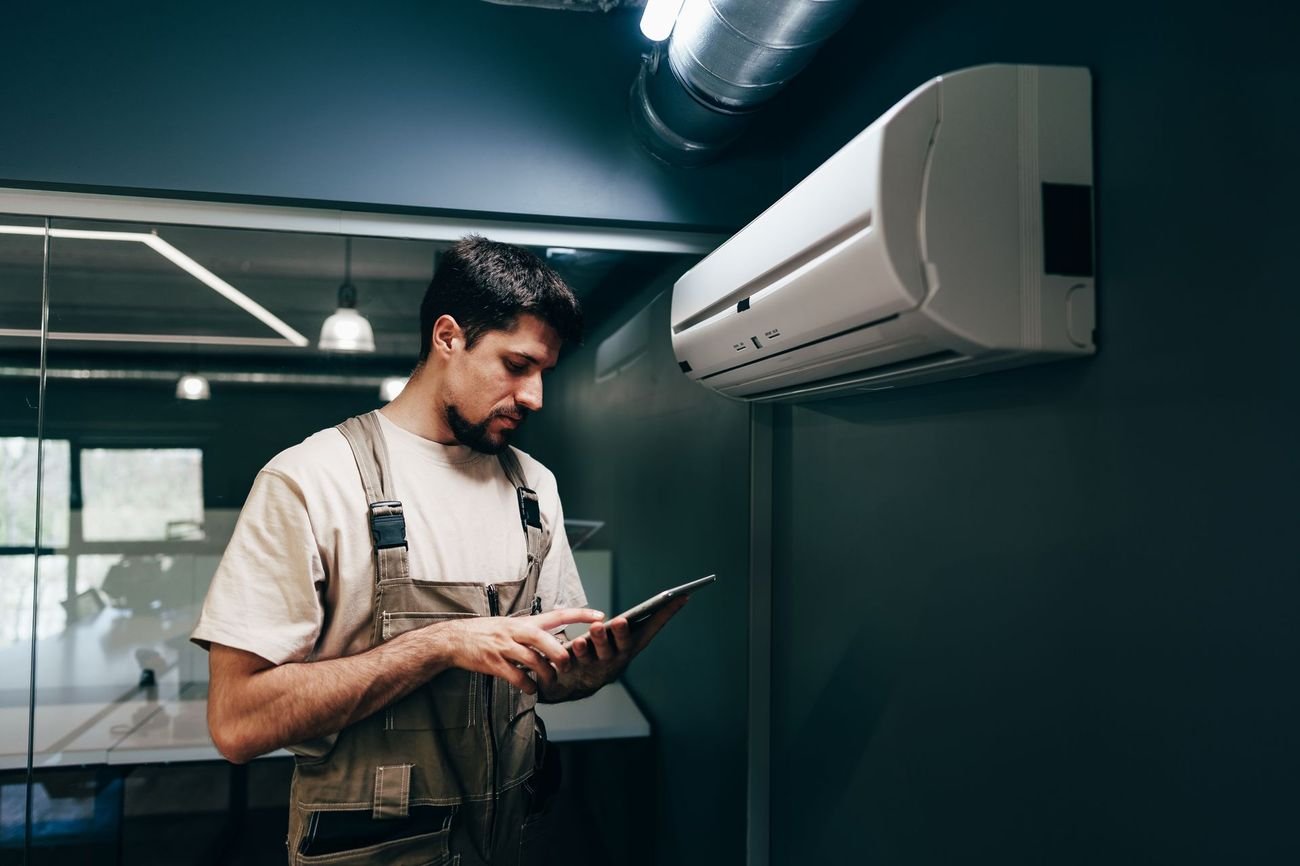 Curtis Fox performing a garage door safety inspection